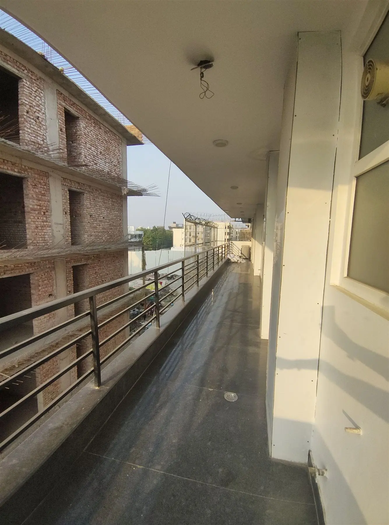 A long private balcony at Commune Collective