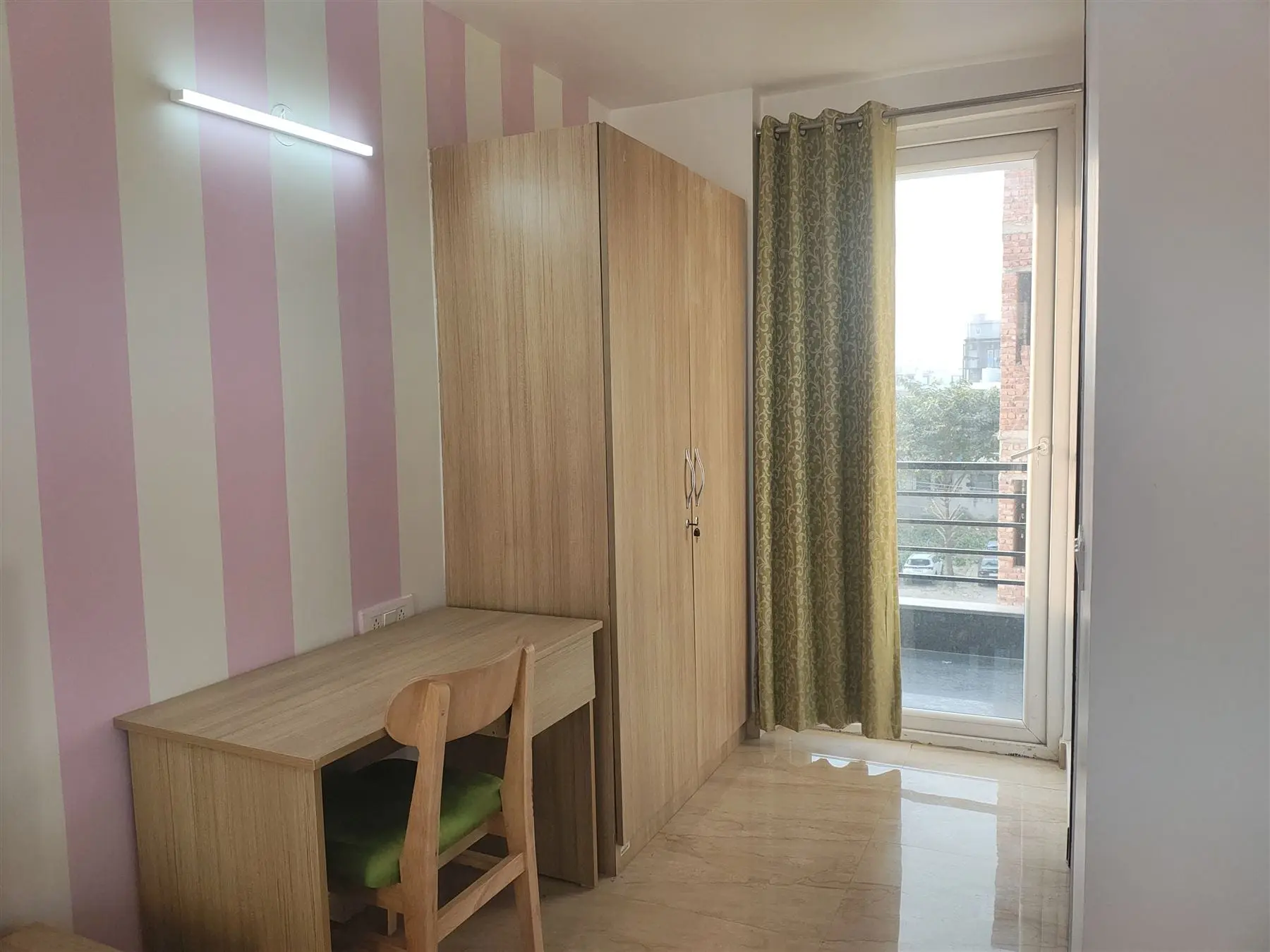 Work desk and wardrobe in a Commune Collective room