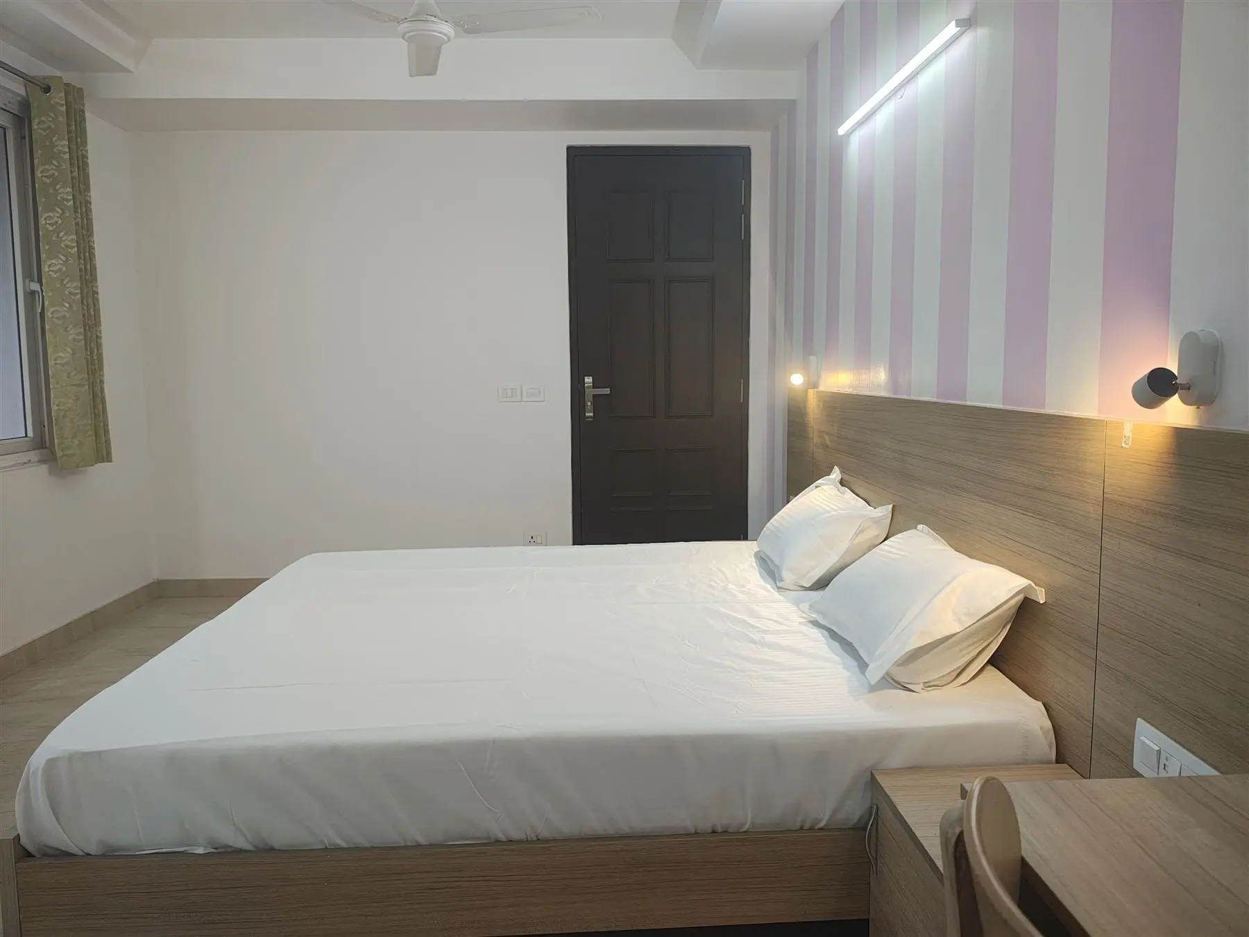 A private room at Commune Collective with a king bed