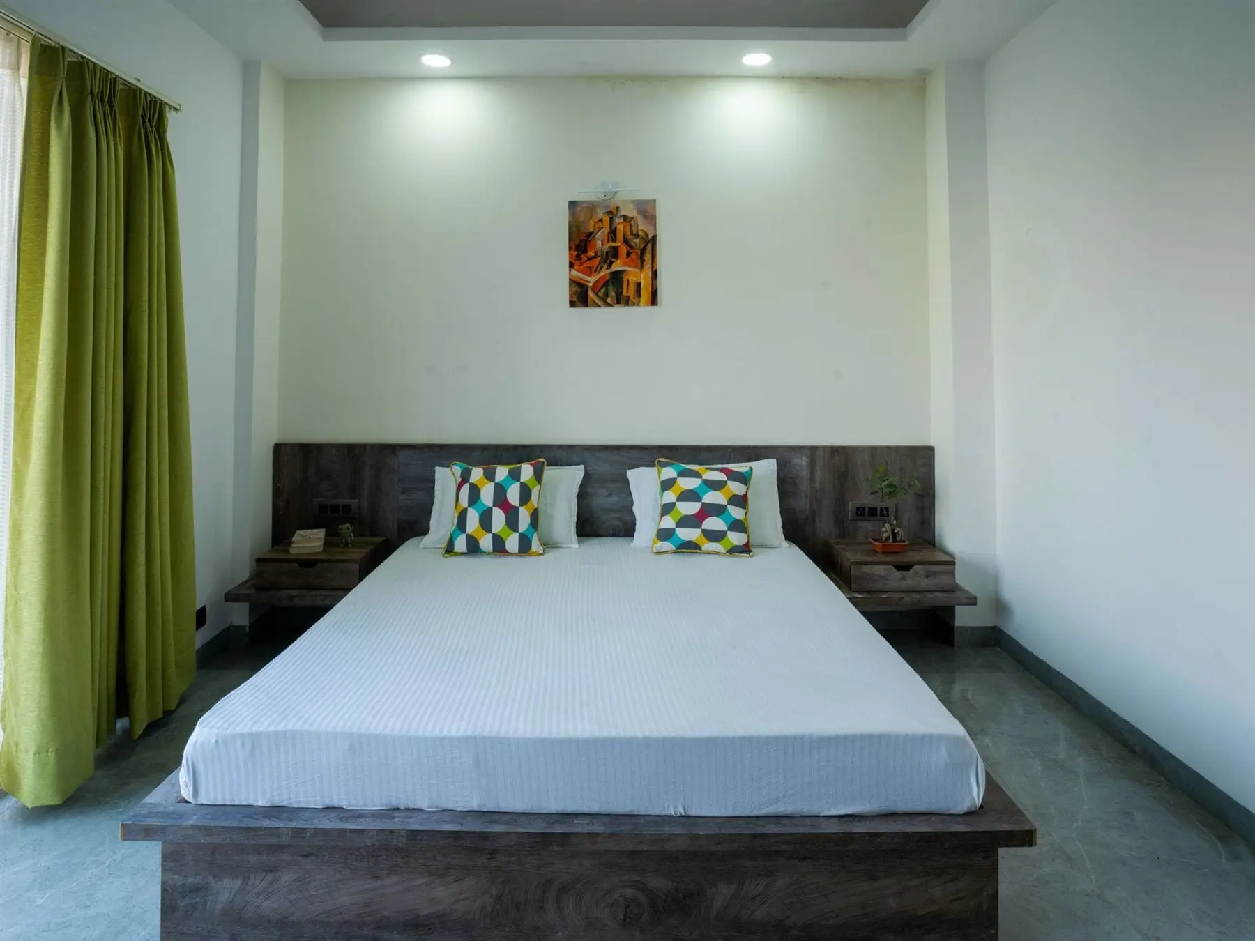 A private room at Commune Greenwood with a queen bed