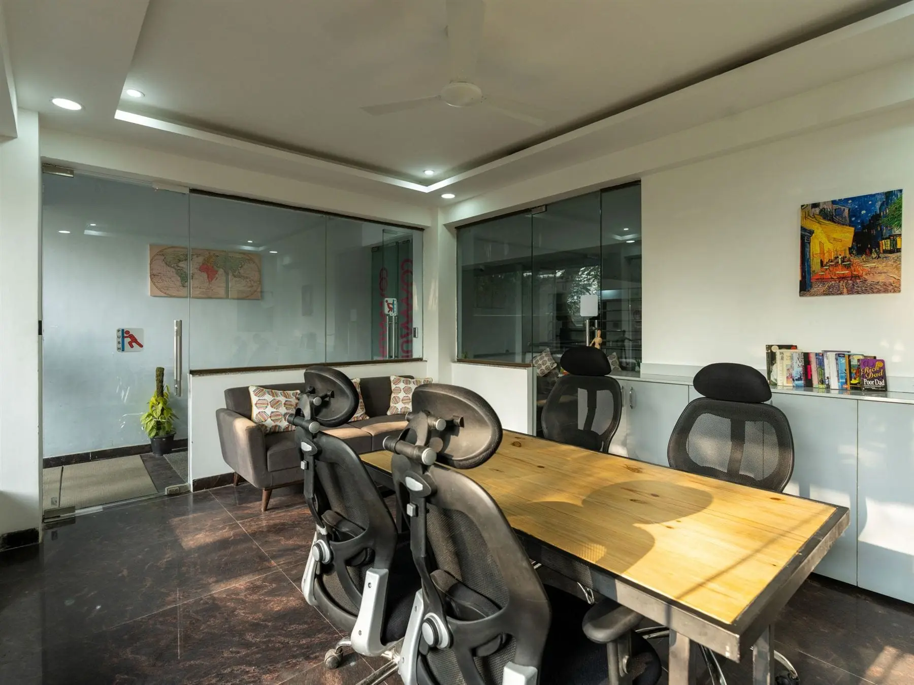 A quiet workspace with desks at Commune Greenwood