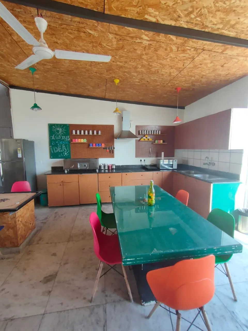 The shared kitchen and dining table at Commune Millennium City