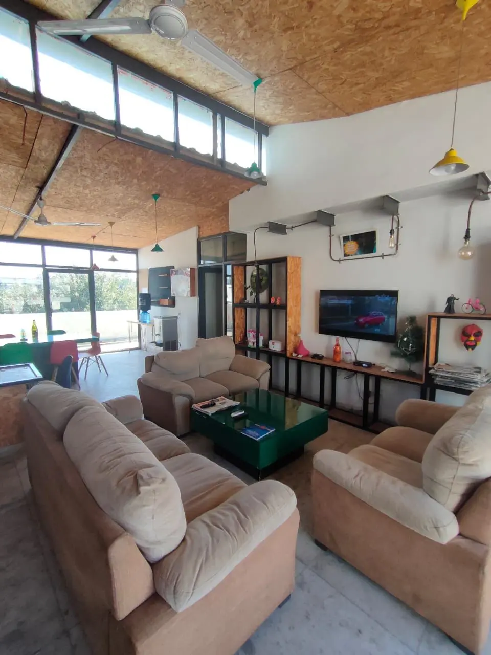 Sofas and bookshelves in the Commune Millennium City lounge