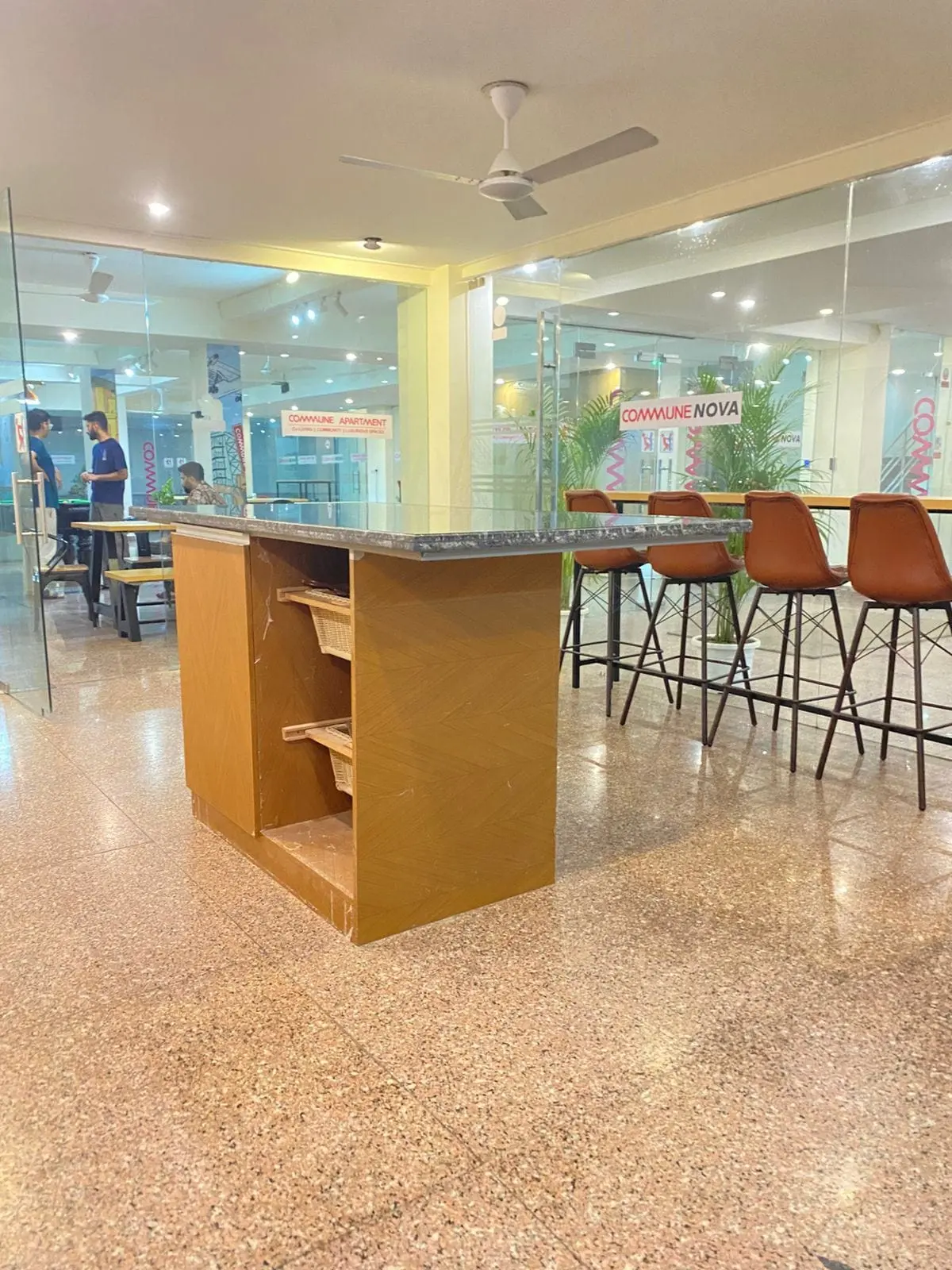 Bar stools and counter in the Commune Nova lounge