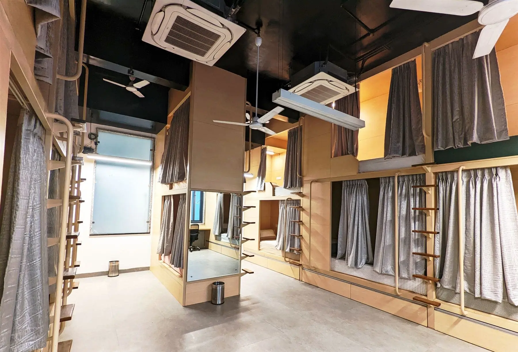 Private sleeping pods with curtains at POD Prime