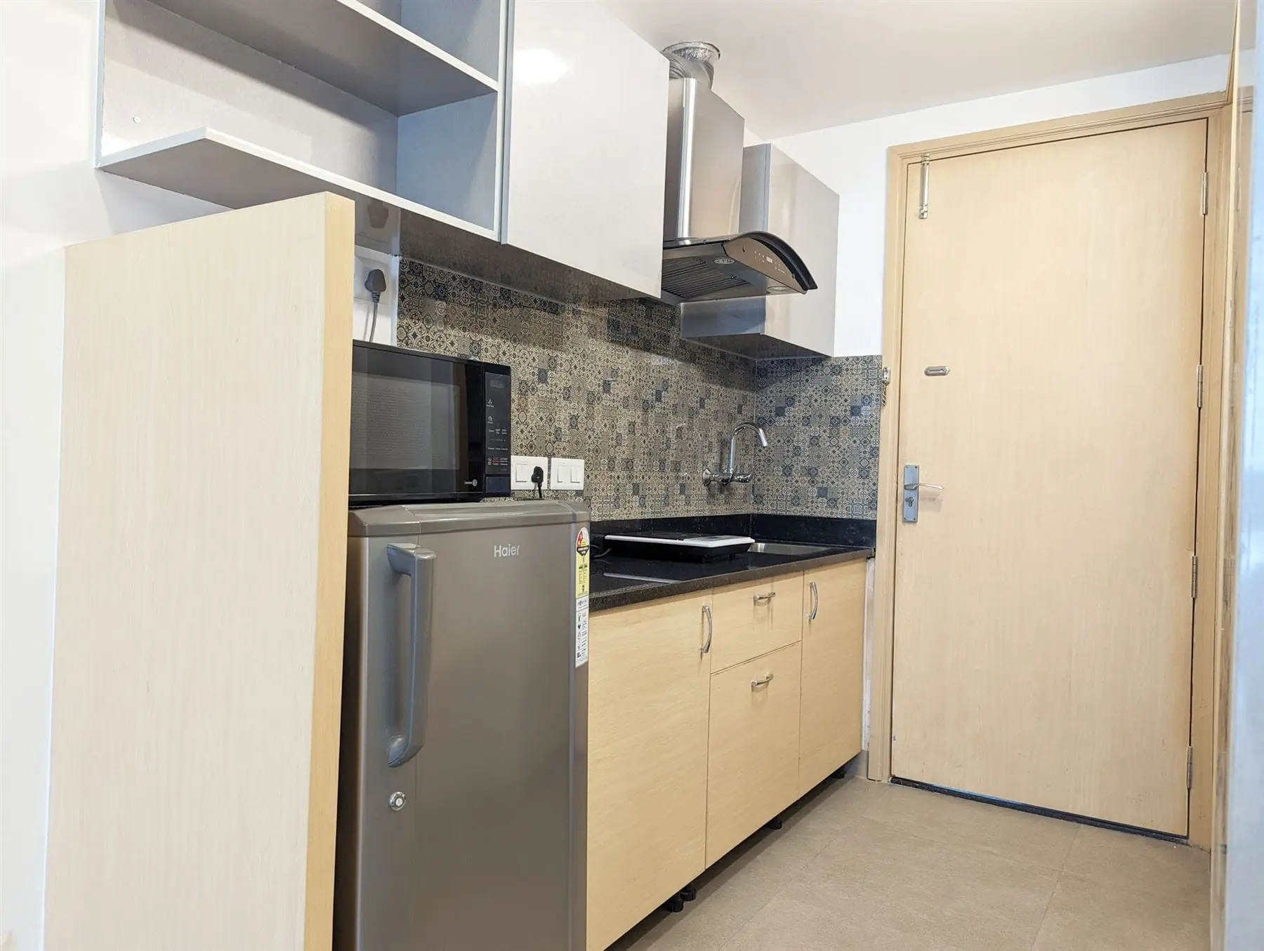 In-room kitchen pantry with hob, microwave and fridge