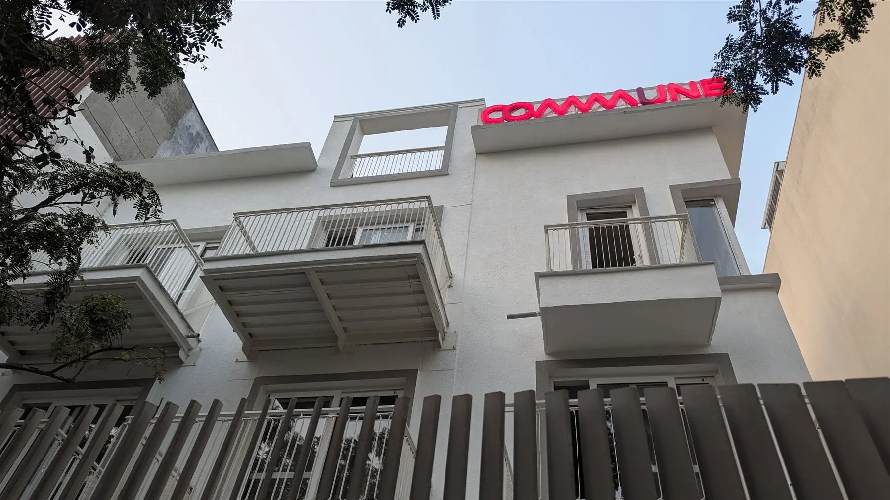 The front of Commune Siris with balconies on every floor