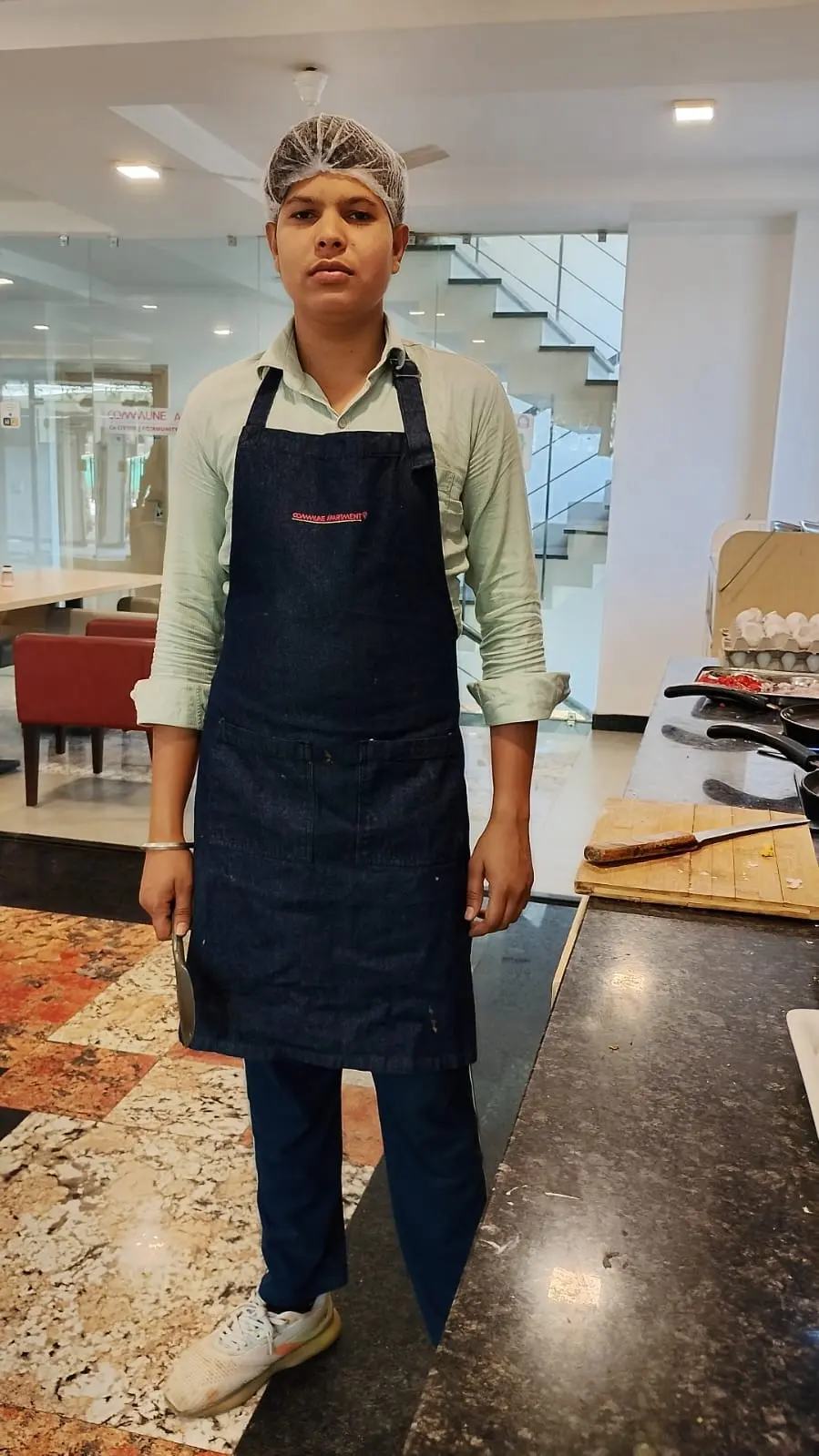 One of the Commune chefs in the dining area