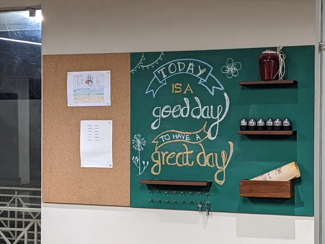 Chalkboard wall reading 'Today is a good day' at Commune Anant