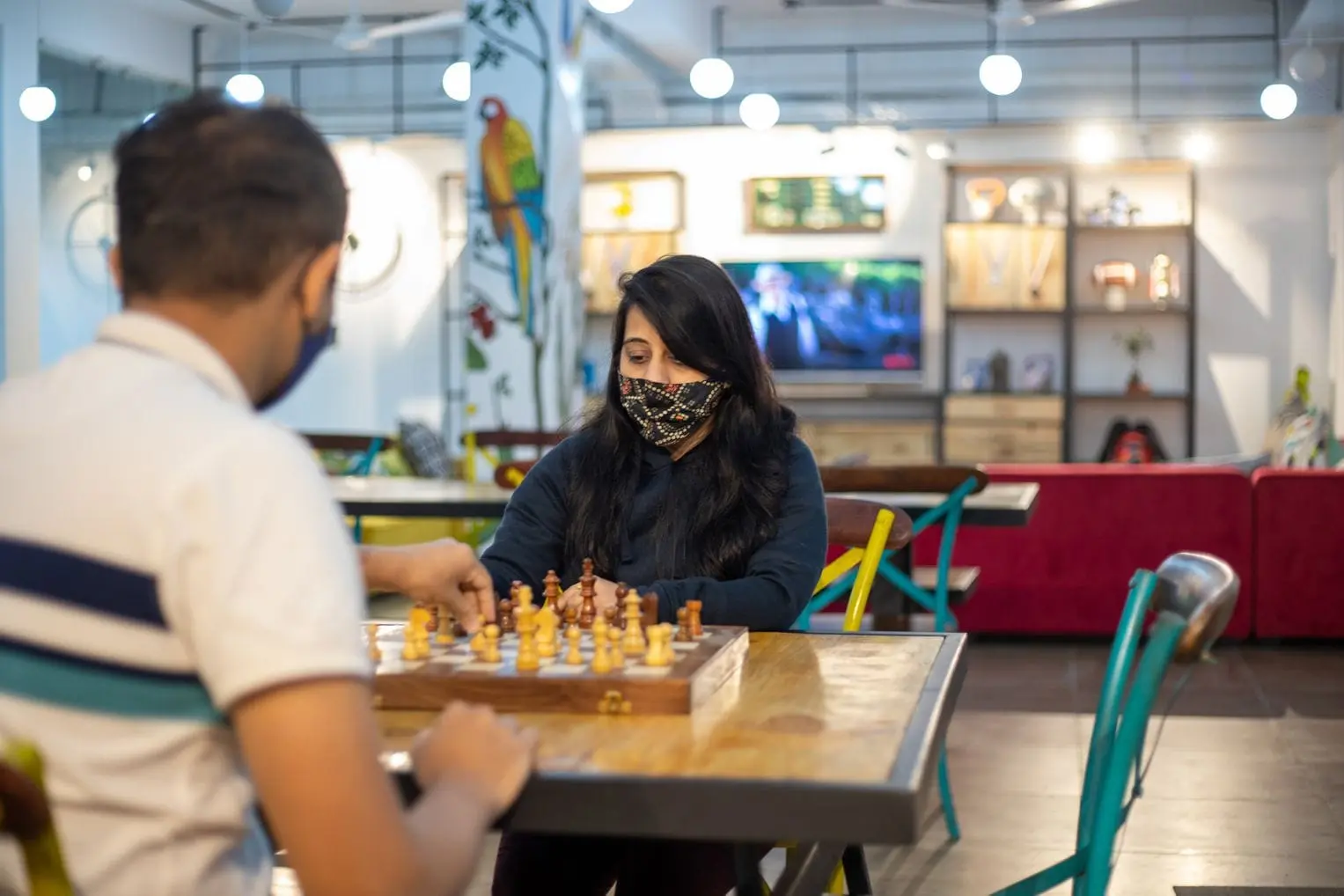 Communrs playing chess in the lounge