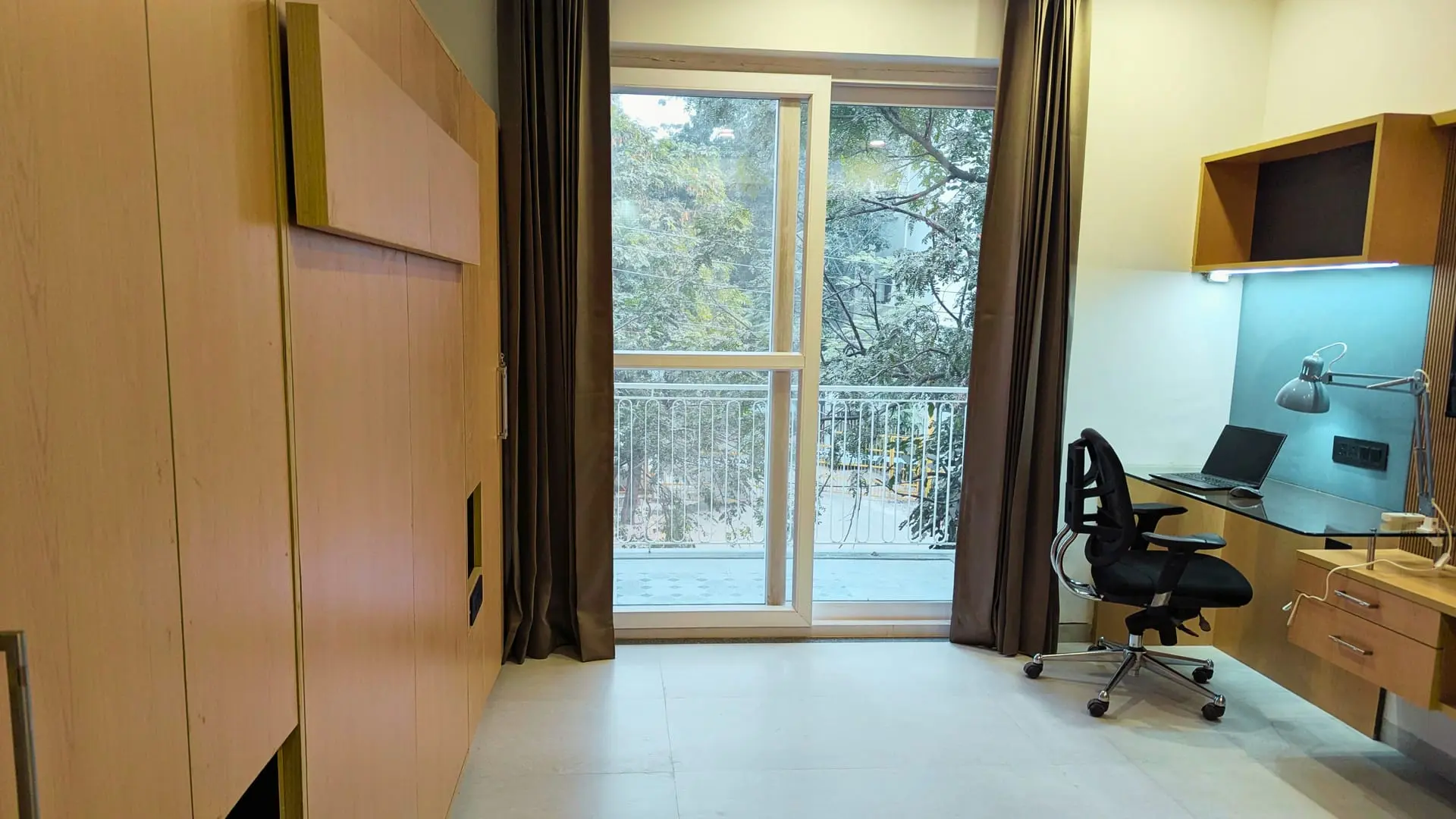 Private study nook with balcony access in a Commune Residence apartment