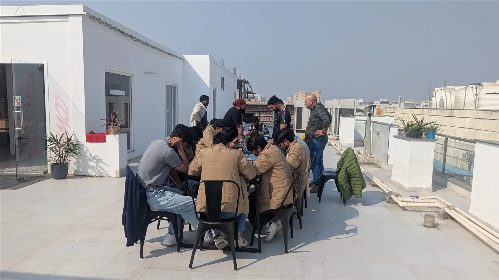 The Commune team gathered on a rooftop